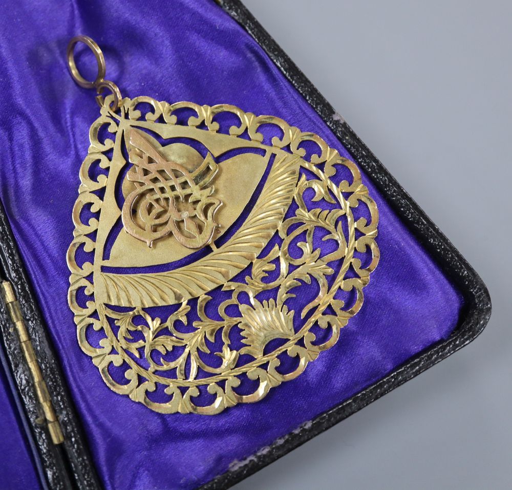 A 20th century Turkish pierced yellow metal pendant, 62mm, 13 grams.